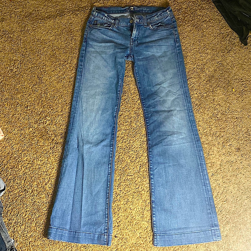 The brand is “7”, low waist bell bottom